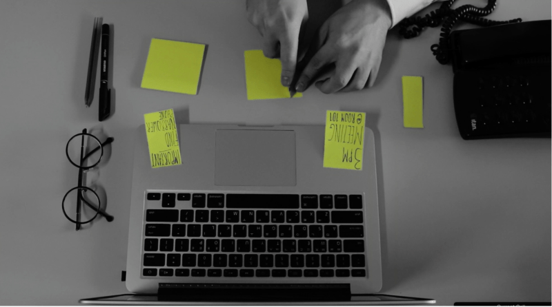 Clip from Stenomania movie, guy cutting postit notes into narrow bits