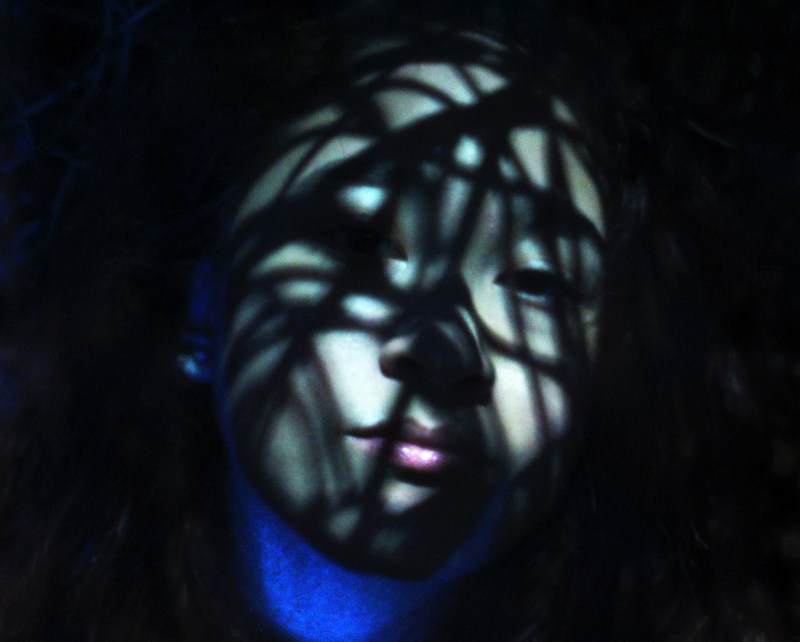 Photography of girl staring in contrasting light